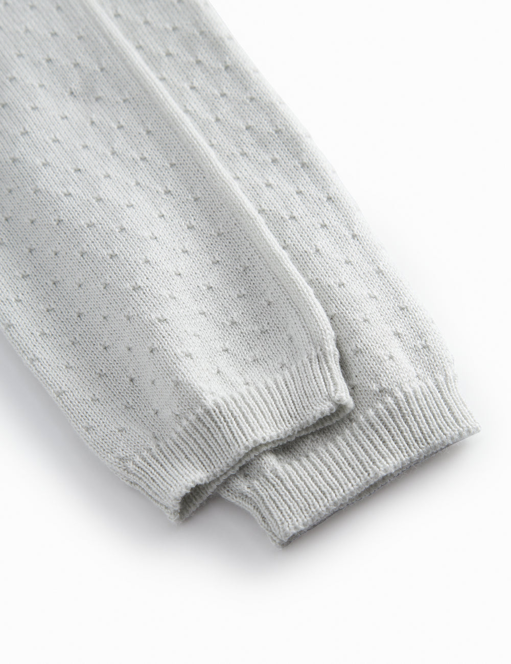 Lysegrøne baby strikbukser med fint hulmønster