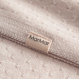 Lyserød baby striktæppe med hulmønster