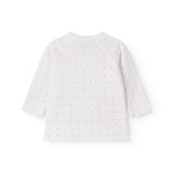 Hvid babybluse med slå-om lukning og små blomster