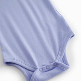 Kortærmet lyselilla bodystocking til baby