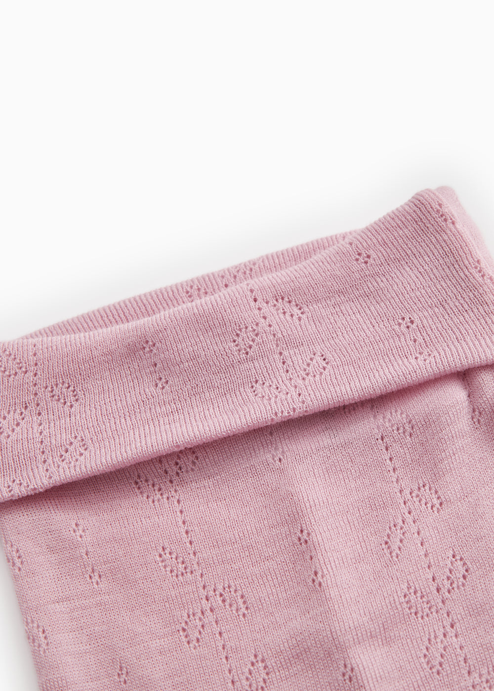 Børnebukser i soft berry-pink med bred ribkant øverst og hulmønstret strik