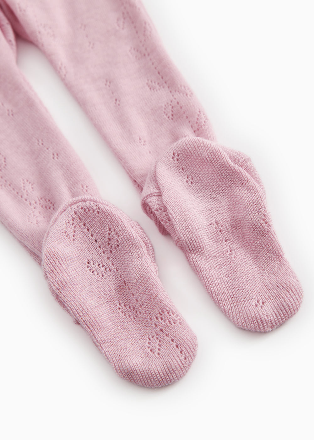 Strikbukser i soft berry-pink med ribbede foddele og fint hulmønster