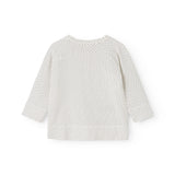Hvid bluse til baby med små sorte prikker og lange ærmer