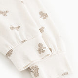 Pyjamasbukser i offwhite med teddy-bjørneprint ved manchet og benkant