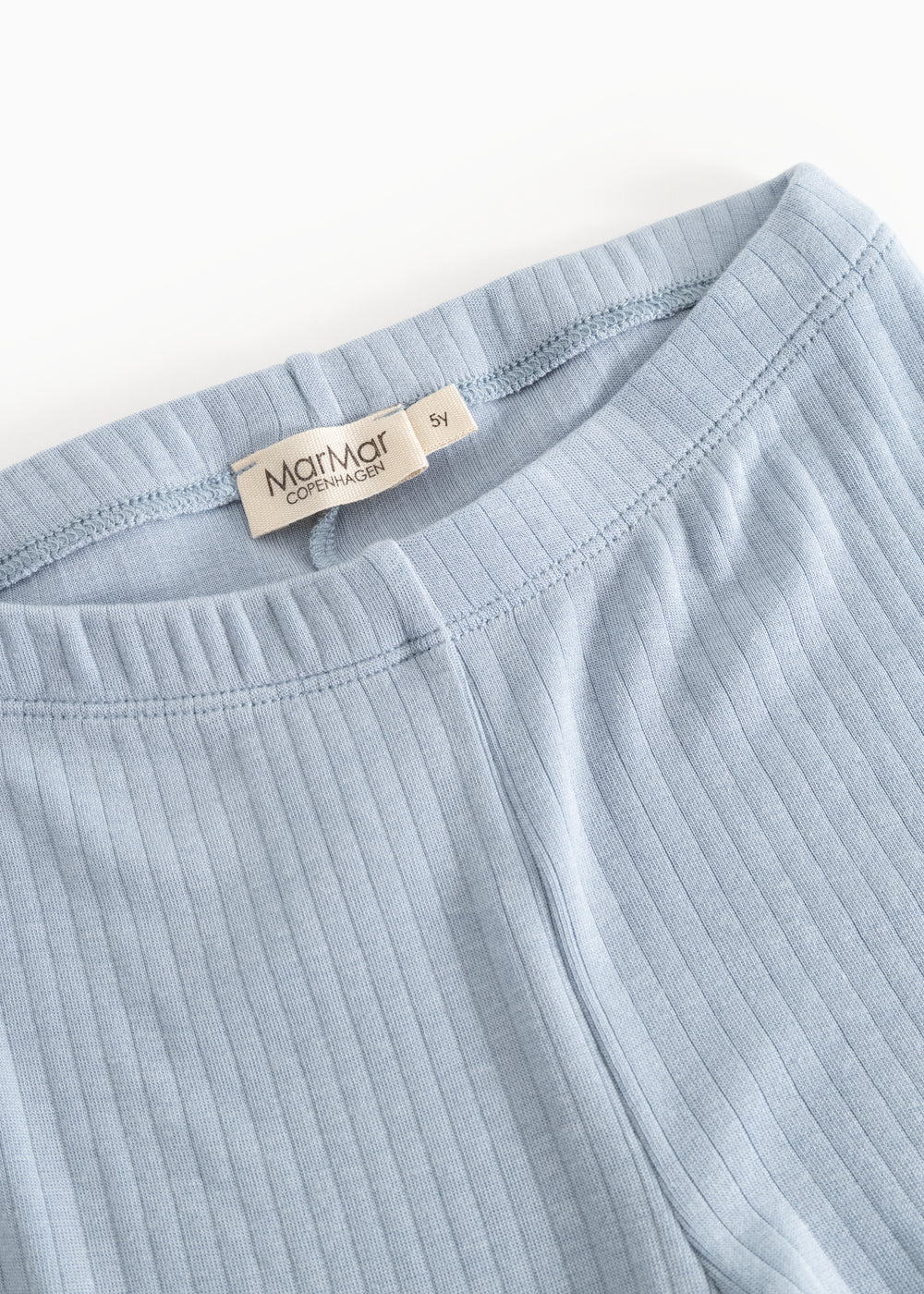 Lyseblå leggings med elastisk taljebånd og ribbet sømdetalje.
