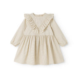 Flødefarvet kjole med lange ærmer, rynket krave og små prikker