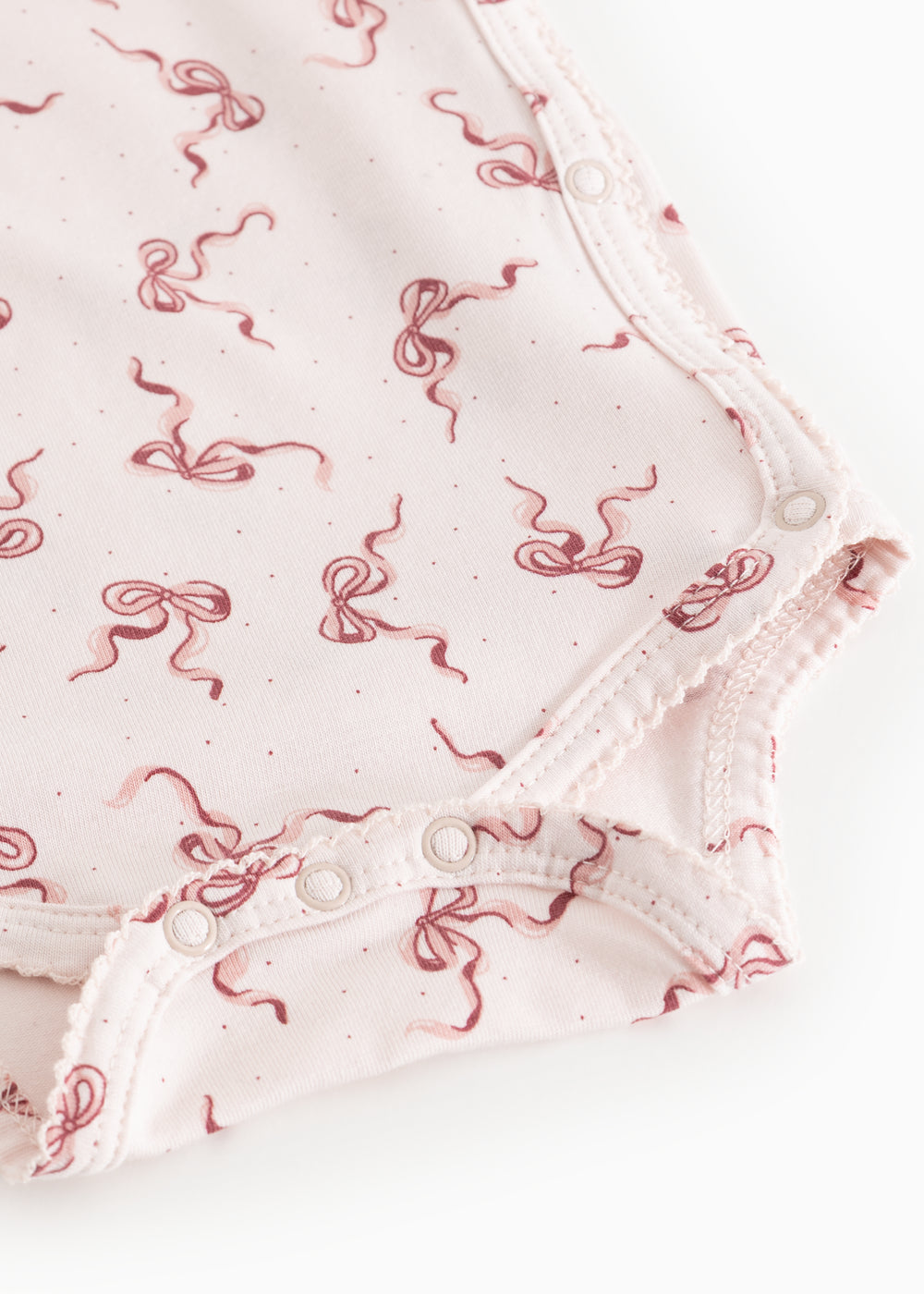 Belita bodystocking med trykknapper i skridt og sløjfeprint