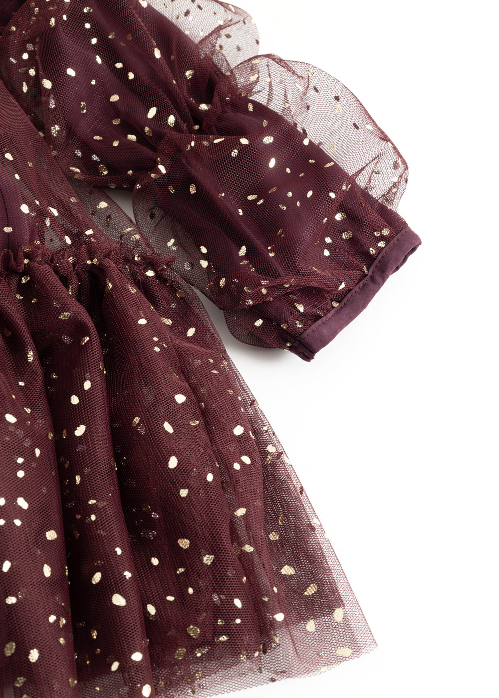 Tylærme og skørt i mørk bordeaux med guldfarvede prikker